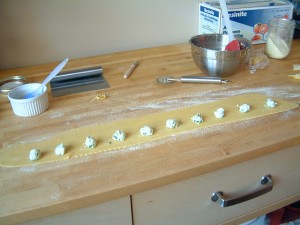 Assembling the ravioli pasta into pillows